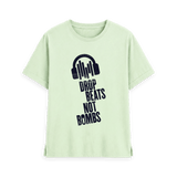Pastel Green t-shirt with navy blue Drop Beats Not Bombs logo, front view